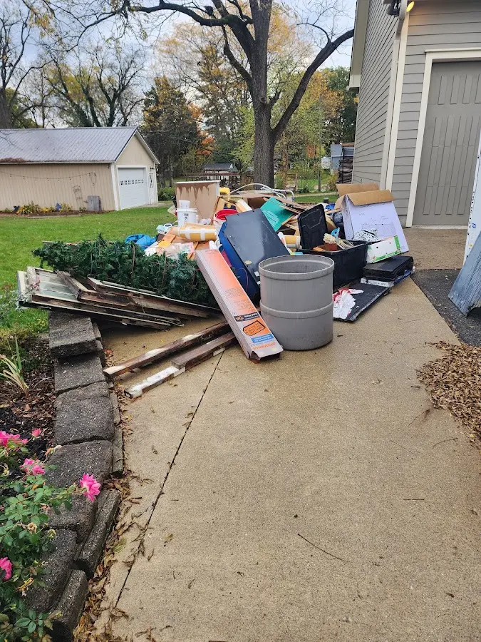 Dumpster being loaded with debris for 30 Yard Dumpster Rental in Old Forge
